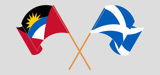 Crossed and waving flags of Antigua and Barbuda and Scotland