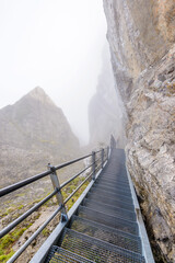 View of foggy Swiss Alps from Mt. Pilatus trail and Lucerne lake (Vierwaldstattersee) in Lucerne, Switzerland