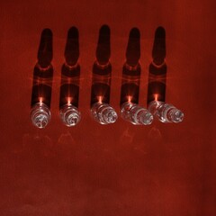ampoules on a brown backgound