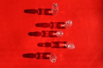 ampules on a red backdrop