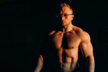 Fototapeta premium Muscular fitness shirtless man in glasses.