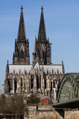 view of the cologne cathedral and the hohenzollern bridge
