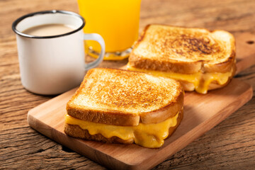Grilled ham and cheese. Sandwich with cheese and ham on grill.