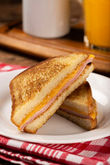 Grilled ham and cheese. Sandwich with cheese and ham on grill.