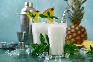 Pina colada - coconut and pineapple cocktail with cream. - obrazy, fototapety, plakaty