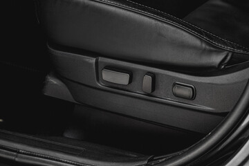 Fototapeta na wymiar Electric car seat adjustment control panel close up view. Adjustable car seat position. Car interior.