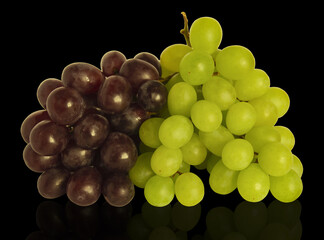 bunch of grapes on a black background
