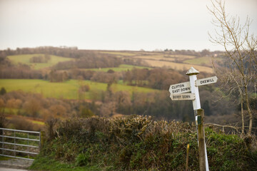 Wooden directional road sign to give directions in the countryside