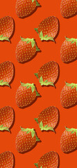 Whole strawberry fruit pattern on red color
