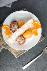 Carnival dessert on plate isolated on black background