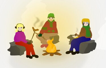 family frying sausages on a bonfire in winter