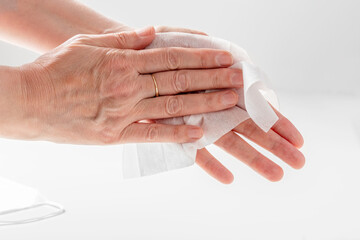 A man wipes his hands with a disinfectant napkin. Close-up. Hygiene. High quality photo