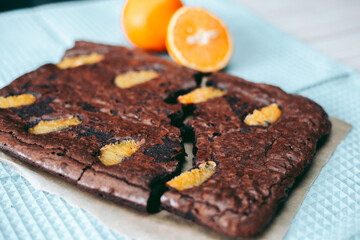 Freshly baked aromatic chocolate brownie with orange