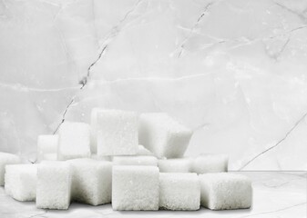 Cubes of white sweet sugar on the desk