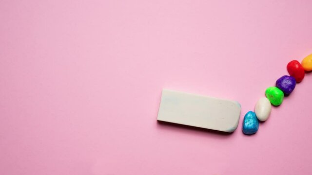 draw a line of colored pebbles with the pen and erase them with the eraser	