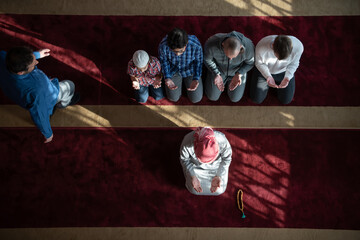 group of muslim people praying namaz in mosque.