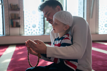 muslim prayer father and son in mosque prayingtogether