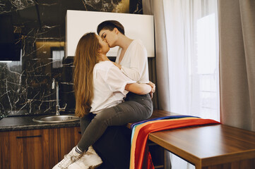 Lesbians hug and love each other with LGBT flag