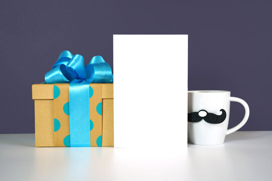 Father's Day or masculine birthday theme greeting card styled with gifts. White product mock up with negative copy space for your text or design here.