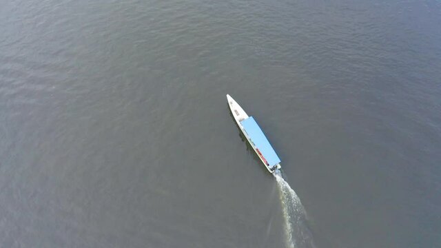 DRONE DJI MAVIC 2 PRO AERIAL IMAGE BOAT LEAVING THE RINGS OF THE RIVER OIAPOQUE BRAZIL AMAZON FOREST