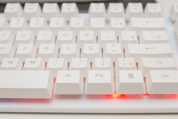 white gamer keyboard with colorful lights in rio de janeiro.