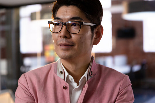 Portrait Of Confident Stylish Asian Businessman Looking To Side