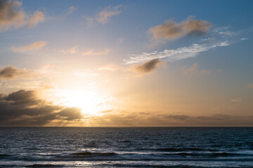 Fototapeta na wymiar Dramatic sunrise at the beach