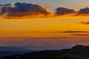 Naklejka na ściany i meble Sunset over quaint Tuscan Village Italy