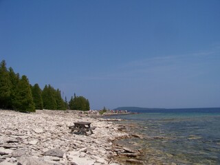 Fototapeta na wymiar Picnic spot at the stone beach on lake Huron in Canada