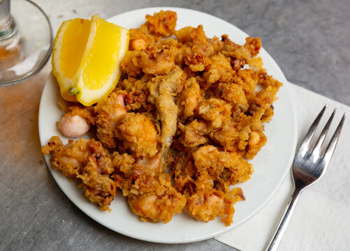 Chipirones a la andaluza, battered fried baby squid served with lemon