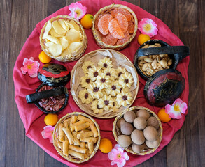 Chinese festive delicacies / Chinese New Year Snacks / Common in most homes during the festival, dried fruits, biscuits, peanuts, candy, deep fried shrimp rolls and arrowheads to entertain friends