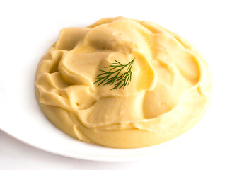 Isolated mashed potatoes on the white plate.
