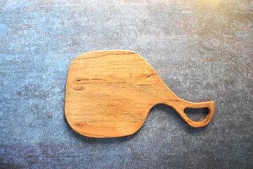 Curved empty wooden platter made from acacia wood