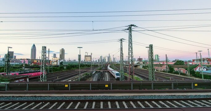 Timelapse of frankfurt railroad with skyline in background shot in 4k