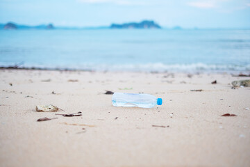 Fototapeta na wymiar plastic Bottle garbage on the beach. Ecology, Environmental, pollution and Ecological problem concept