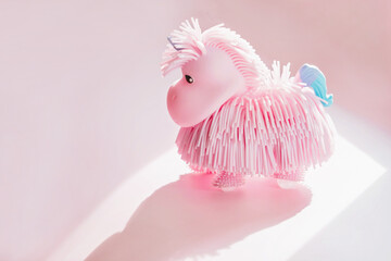 Pink toy silicon unicorn, cute fairy tale animal for children game, small cartoon toy for girl on...