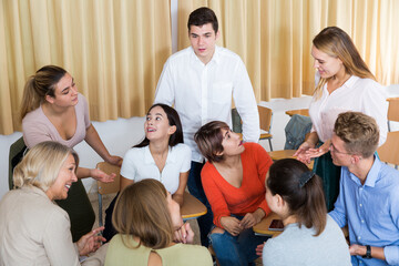 Happy young university students brainstorming while preparing for exam together. High quality photo