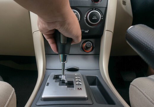 Man driving hands changing gear while driving in the car selective focus. safety driving