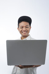 portrait of a cheerful teenager holding a laptop computer  isolated in white