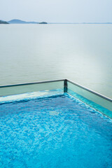 Fototapeta na wymiar Swimming dipping pool against the sea in Malaysia.