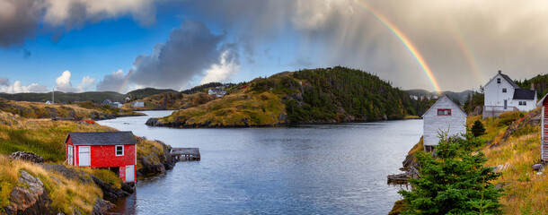 View of a small town on the Atlantic Ocean Coast. Colorful Sky with Rainbow Art Render. Taken in Salt Harbour, Newfoundland and Labrador, Canada. © edb3_16