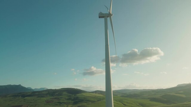 Wind turbine at Ardales, south of Spain. Drone slowly moving up