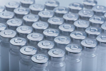 Glass medical ampoule vial for injection. Medicine is dry white drug penicillin powder or liquid...