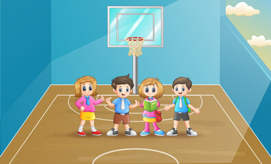 Happy school children in the basketball court