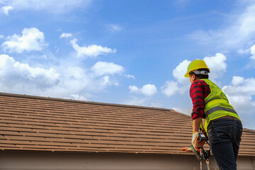 Construction roof repair workers in protective clothing safety in fashion jeans shirt Wear gloves,...