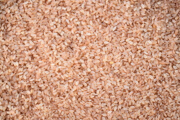 Raw whole dry Matta red parboiled rice cereal grain