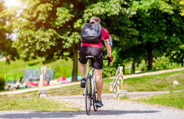 Cyclist ride on the bike path in the city Park
