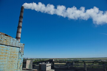 Pavlodar, Kazakhstan - 05.29.2015 : The main pipe for the output of steam to the heating plants.