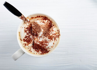 Hot chocolate and marshmallow sprinkled with chocolate chips.