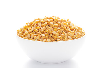 Close-up of Organic Bengal Gram (Cicer arietinum) or split yellow chana dal inside a ceramic white bowl